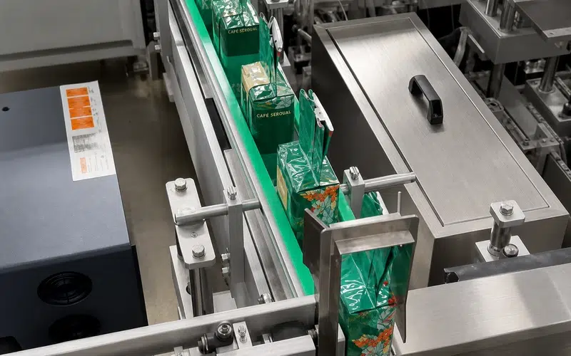 Ground coffee, packaging film and finished vacuum brick bags during AF-VP500 sample testing