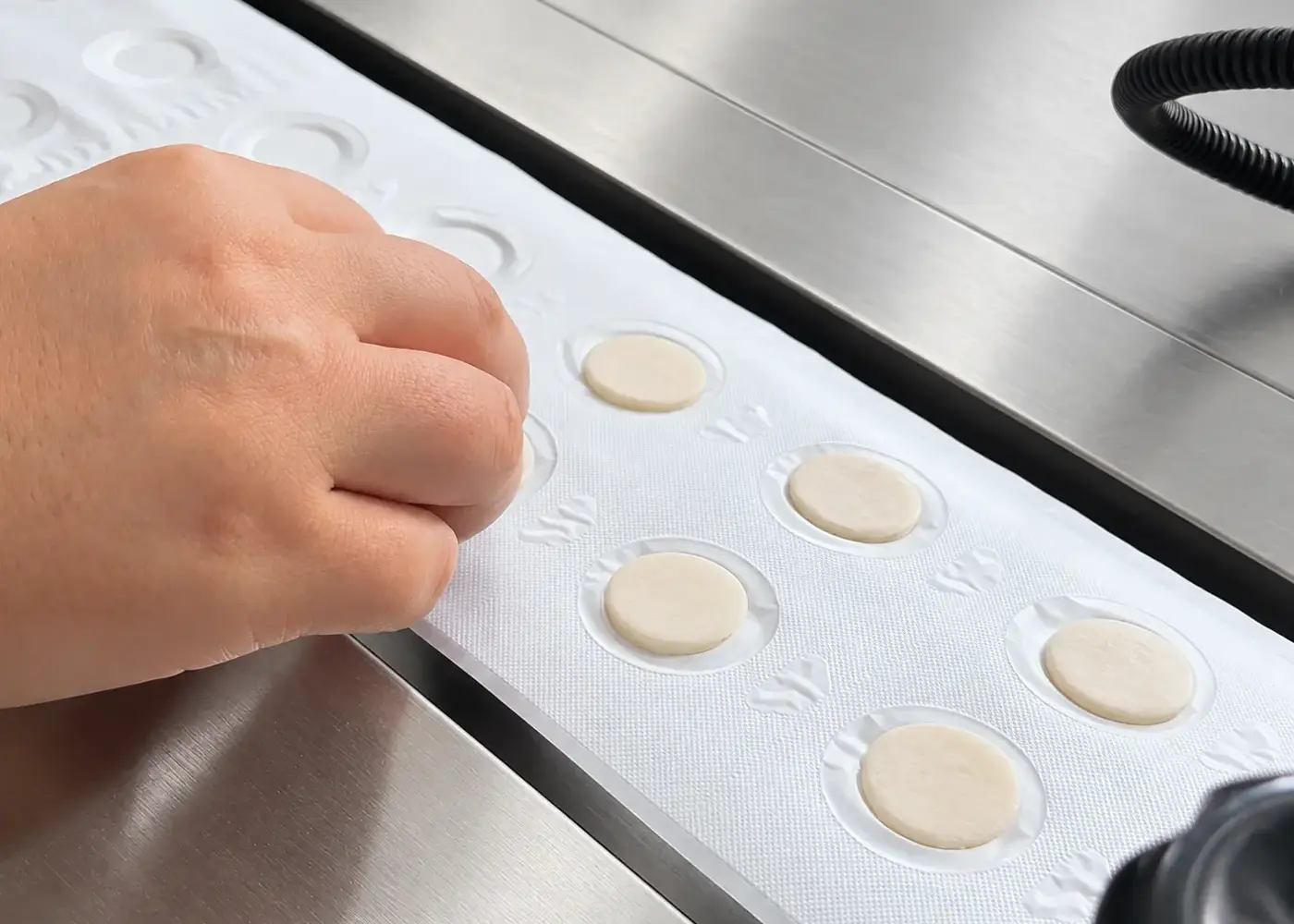 Manual communion wafer placement illustration